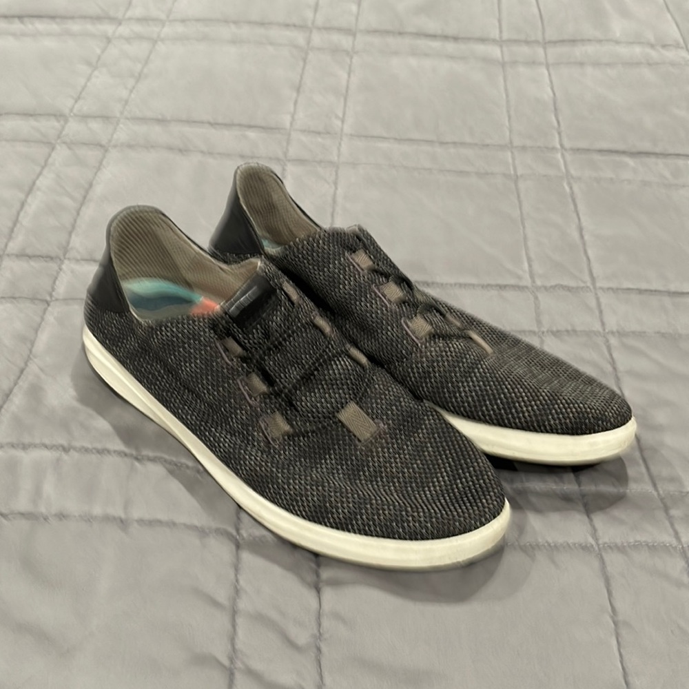 Olukai sneakers woven fabric with a leather back.